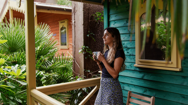 Morning coffee at London Zoo Lodges. Image courtesy of London Zoo Lodges. Woman sipping on a morning coffee at London Zoo Lodges