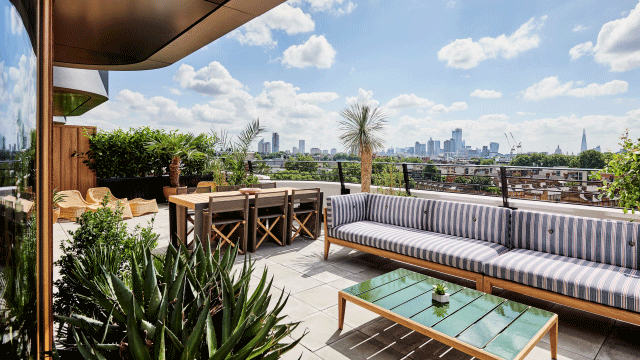 Sun shines on a private terrace at The Standard. Credit: The Standard. Image courtesy of The Standard. Sun shines on the rooftop at The Standard with sofa, chairs and plants